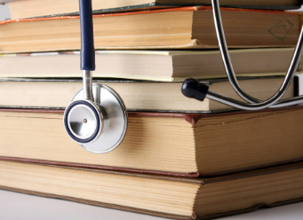 stethoscope and textbooks