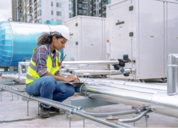 Female inspecting HVAC units